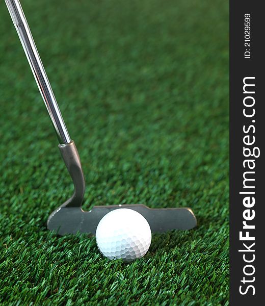 Golfing equipment on artficial grass outdoors