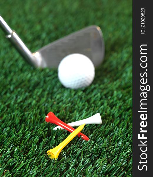 Golfing equipment on artficial grass outdoors