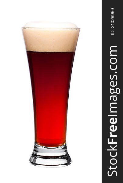 Glass of dark beer on white background