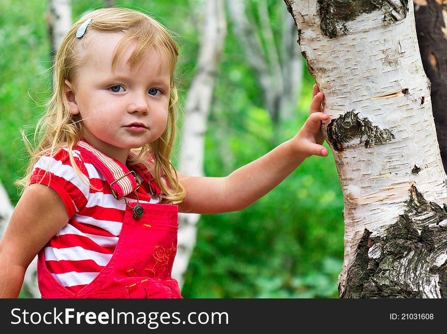 Beautiful girl near the tree outdoor