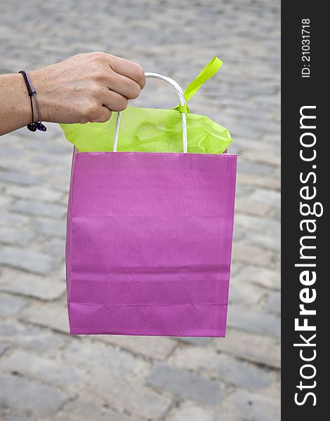 Pink Shopping Bag being Held by a Woman's Hand