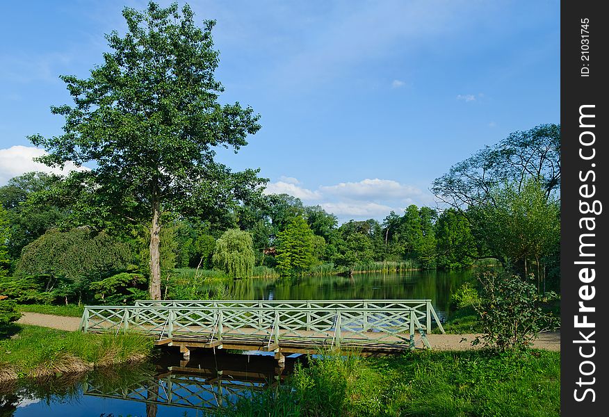 Romantic green wooden footbridge