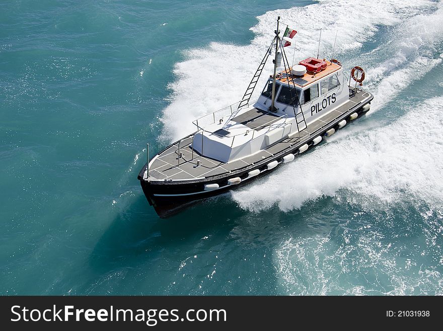 The boat carrying the pilot to a ship to allow access to the port. Front view. The boat carrying the pilot to a ship to allow access to the port. Front view.