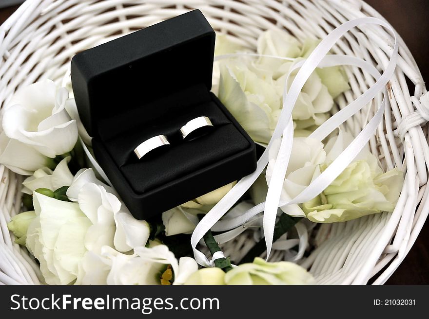 Two wedding rings in a fancy blue box - copy space