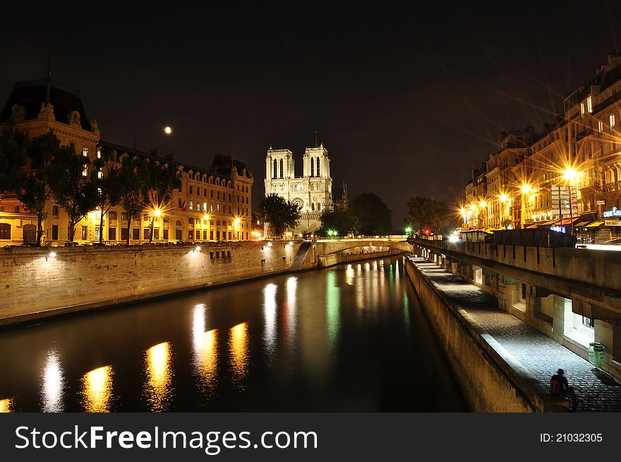 Seine River of Paris with Notre Dame background, taken at night