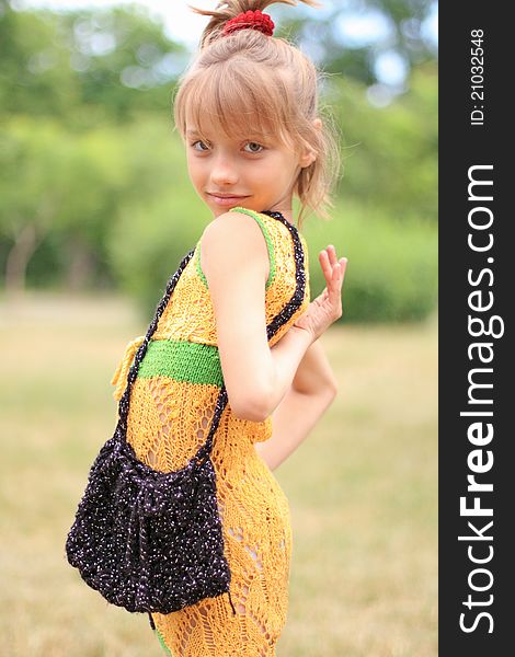 Portrait of the funny little girl in the crocheted dress. Portrait of the funny little girl in the crocheted dress