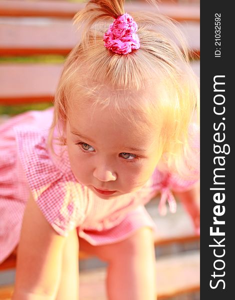 Portrait of the bended girl in a pink dress. Portrait of the bended girl in a pink dress