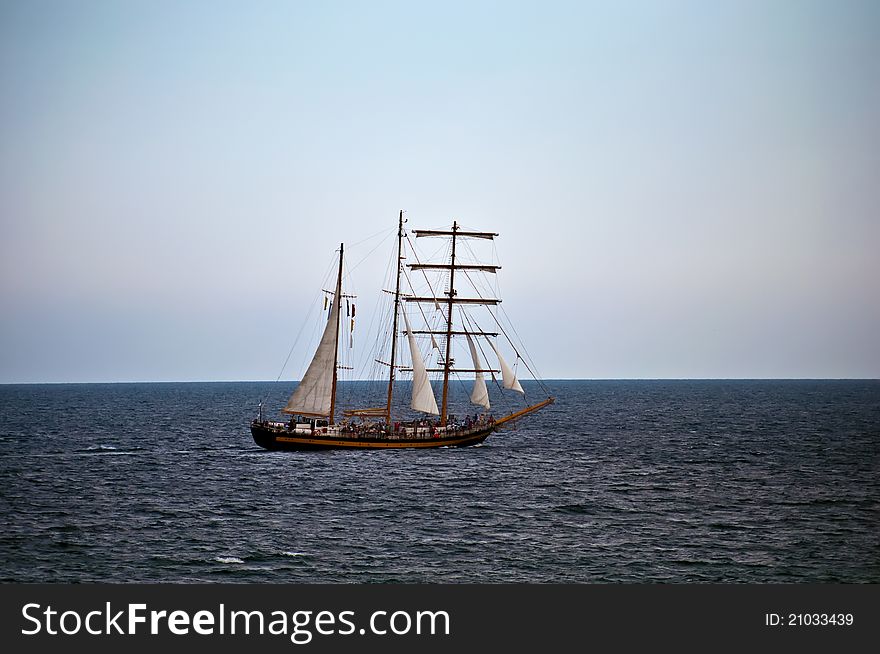 Old sailing ship in the sea .