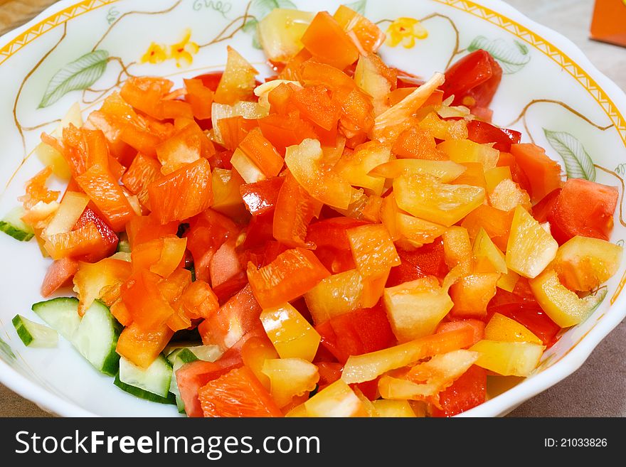 Salad from cucumbers, tomatoes, pepper, an onions and parsley