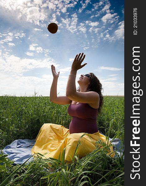 Pregnant Woman On Green Grass Field Under Blue Sky