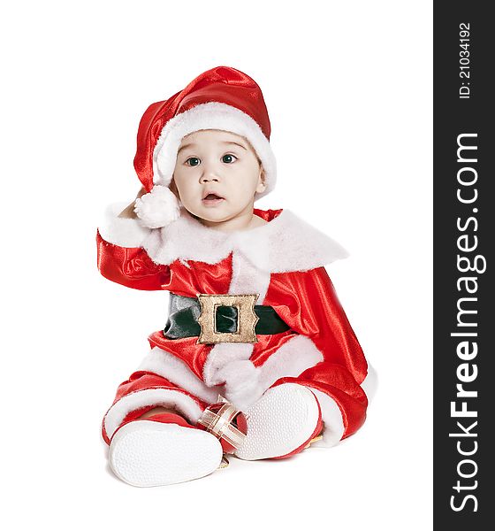 Asian baby boy in a red christmas cap isolated