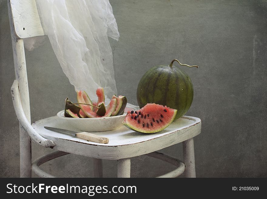 Ripe water-melon on a white chair
