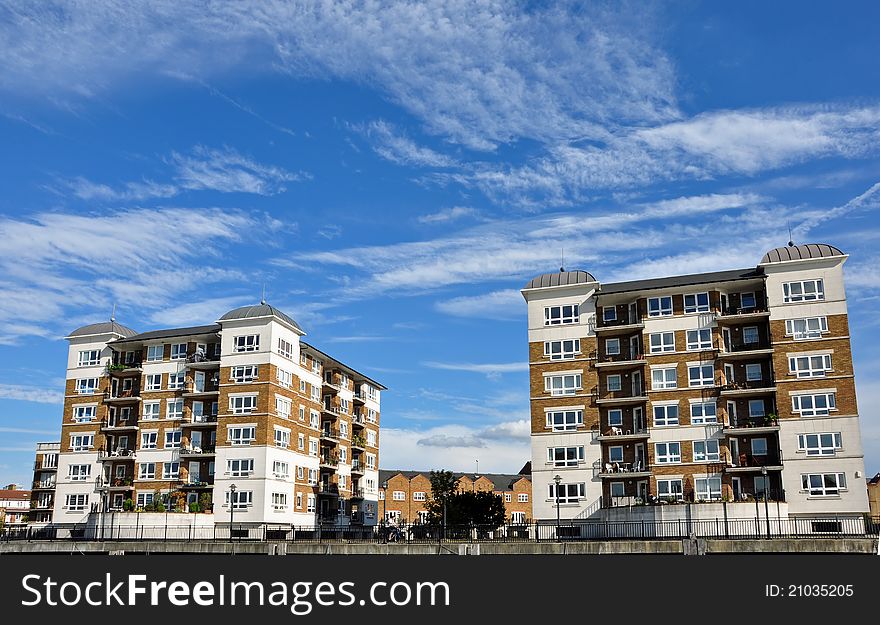 Two identical Buildings with blue sky background. Two identical Buildings with blue sky background