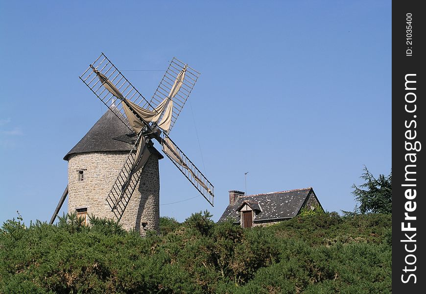 A windmill and the house of the miller at Mont Dol near Dol de Bretagne - Ille et Villaine - France. A windmill and the house of the miller at Mont Dol near Dol de Bretagne - Ille et Villaine - France