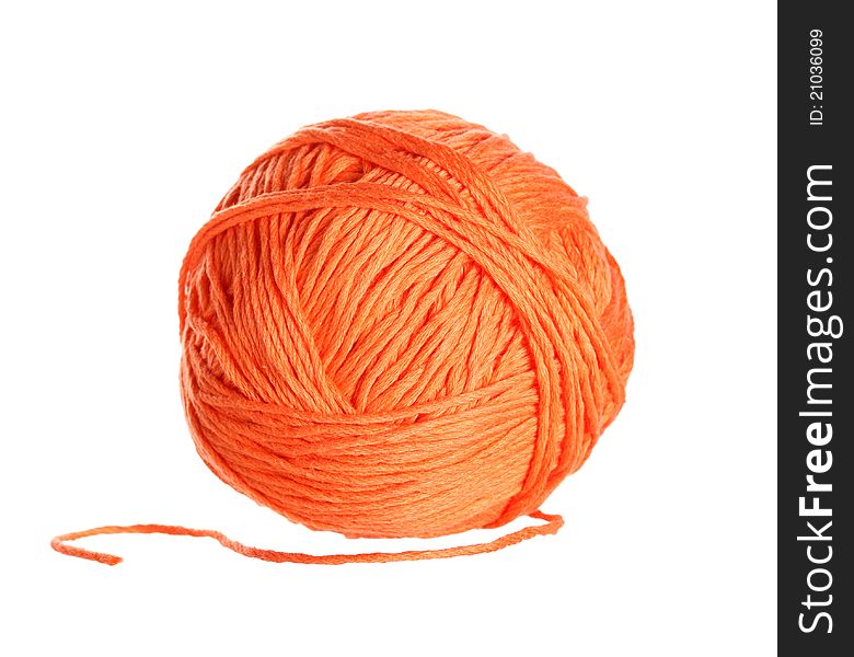 Ball of orange cotton on white background