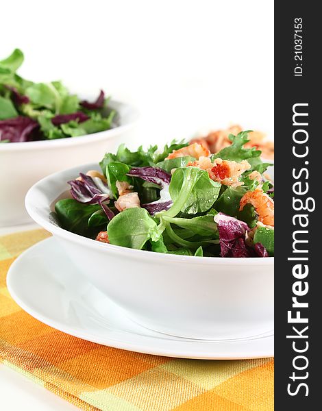 Mixed, colorful salad with crayfish on a white background. Mixed, colorful salad with crayfish on a white background