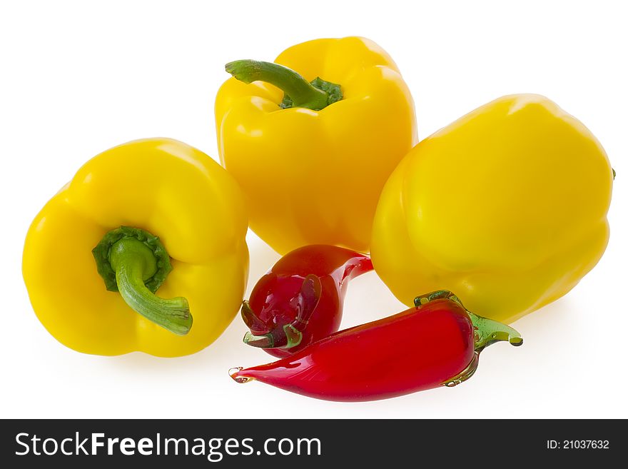 Yellow bell pepper and glass ornament chilli pepper, on white background. Yellow bell pepper and glass ornament chilli pepper, on white background