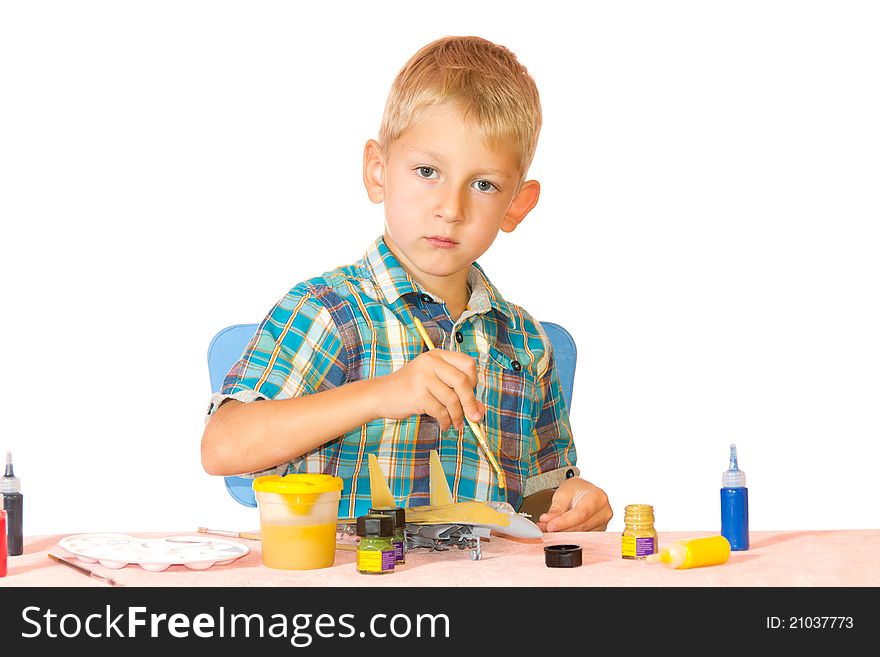 Boy paint airplane model