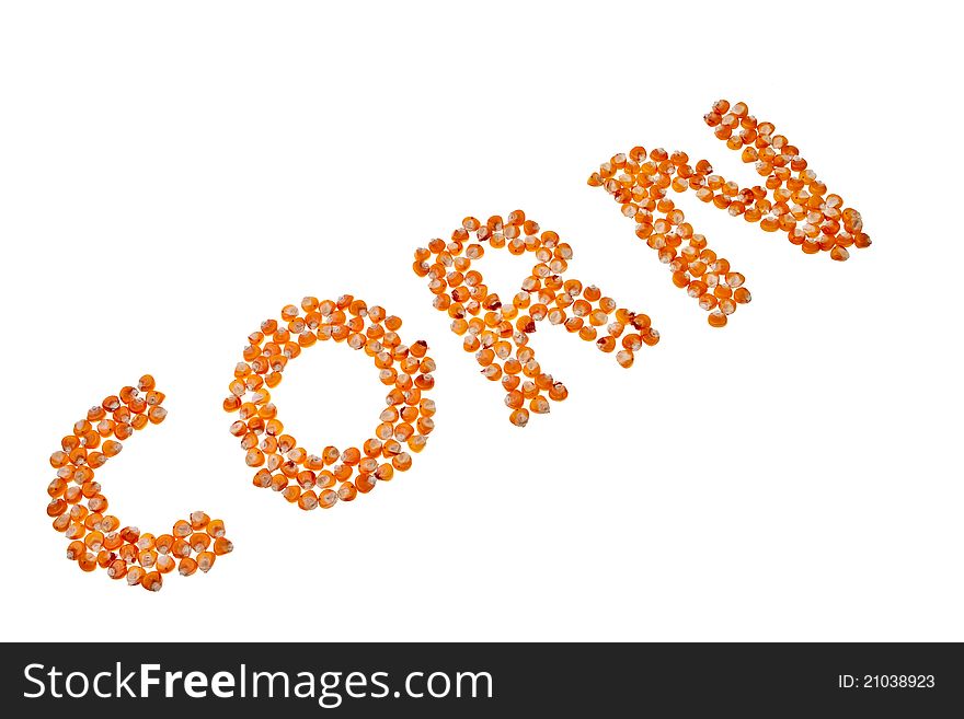 Corn word made out from corn seeds isolated over white background. Corn word made out from corn seeds isolated over white background.