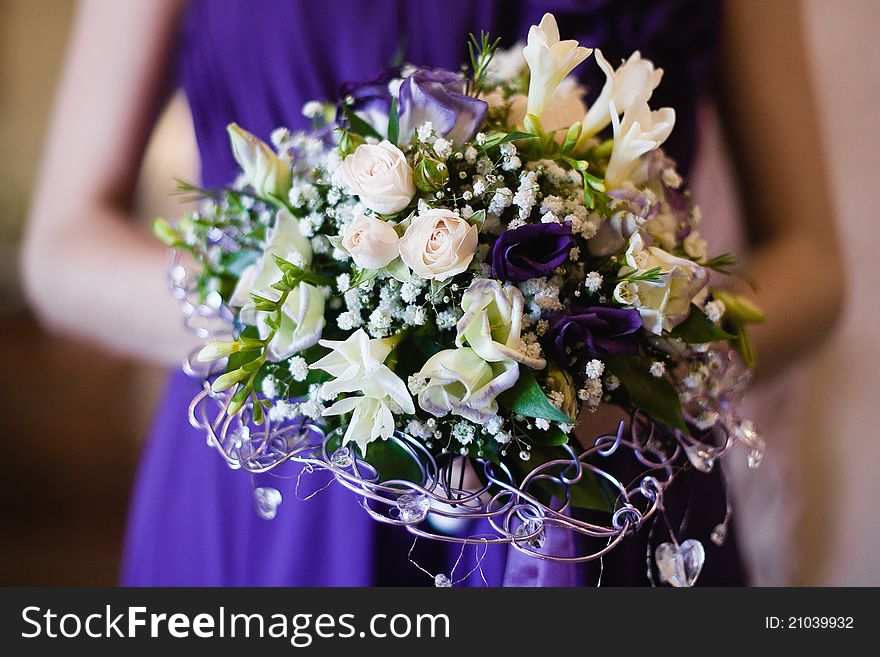 Wedding bouquet of the bride in table