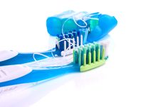 .Two Toothbrushes And Dental Floss Isolated Stock Image .Two Toothbrushes And Dental Floss Isolated Stock Image