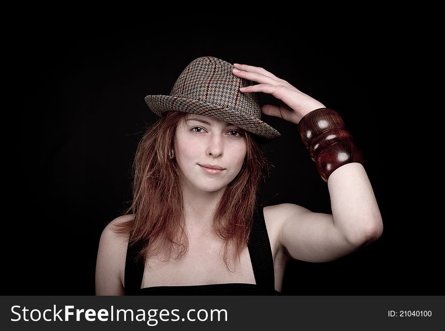 Smiling Girl in hat, black Background