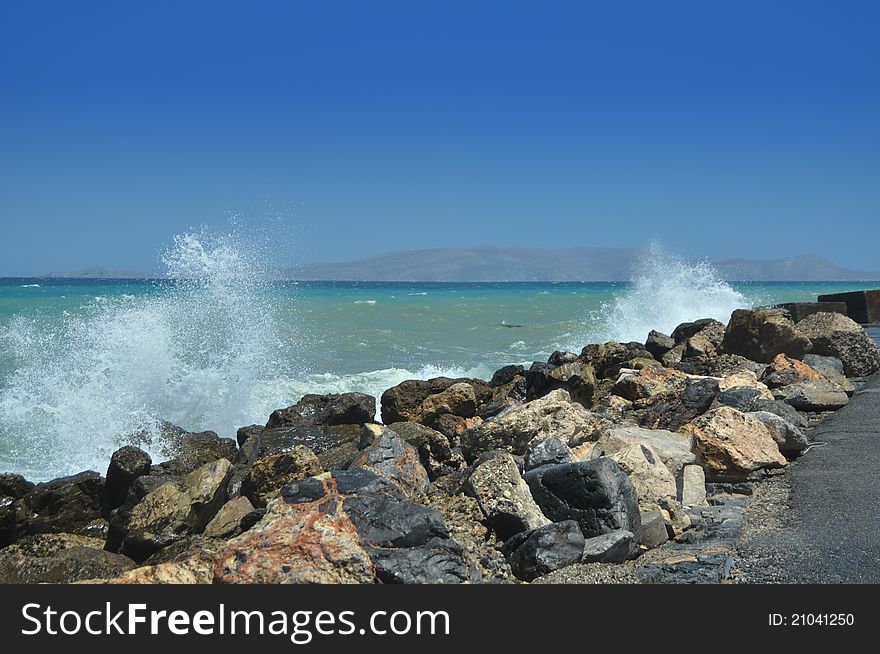 Splashes of breaking waves on the rocky shore