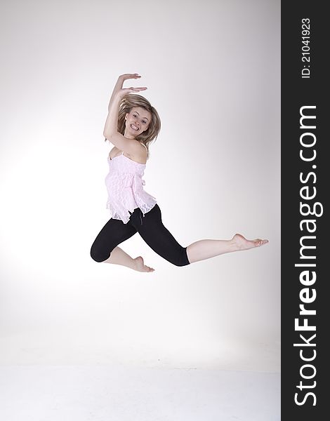 Jumping girl in the studio