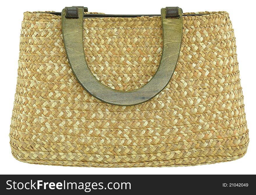 Straw bag with wooden handles isolated