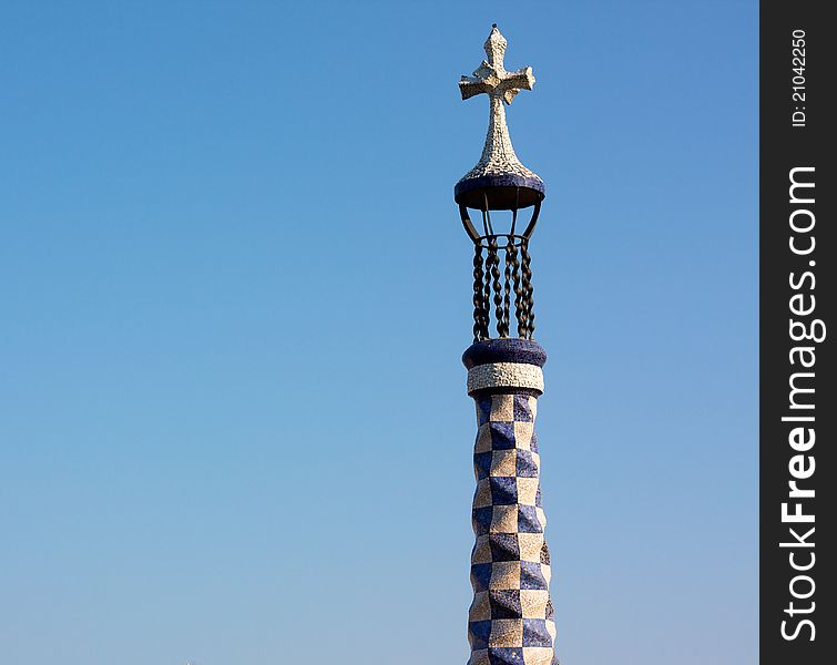 Gaudi's cross in a blue sky