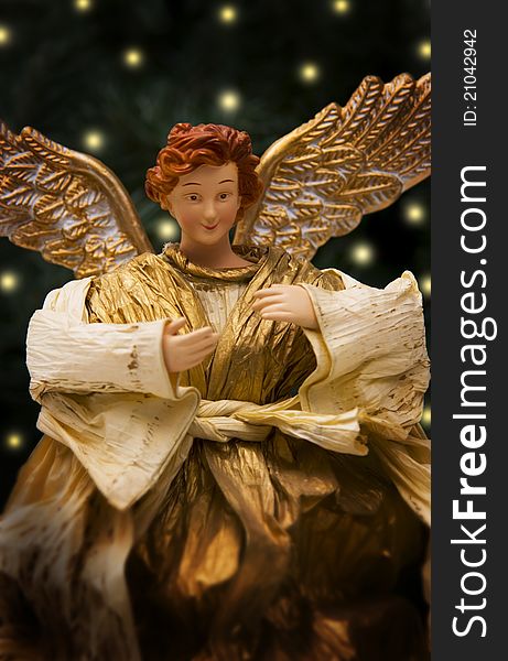 Smiling Christmas angel in tree