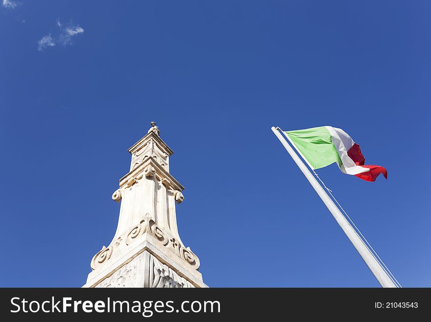 Waving italian flag against blue sky