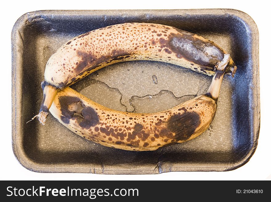 Rotten bananas in a bowl can be used as a background