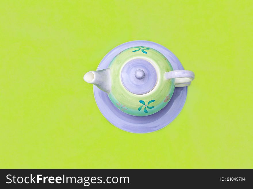 Lovely, hand painted  pastel teapot on green background. Lovely, hand painted  pastel teapot on green background