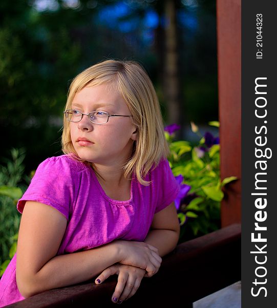 Portrait of a young female child looking into the sunset. Portrait of a young female child looking into the sunset