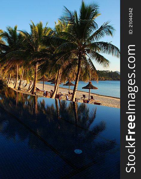 Sunrise on resort swimming pool, Hamilton Island, Australia