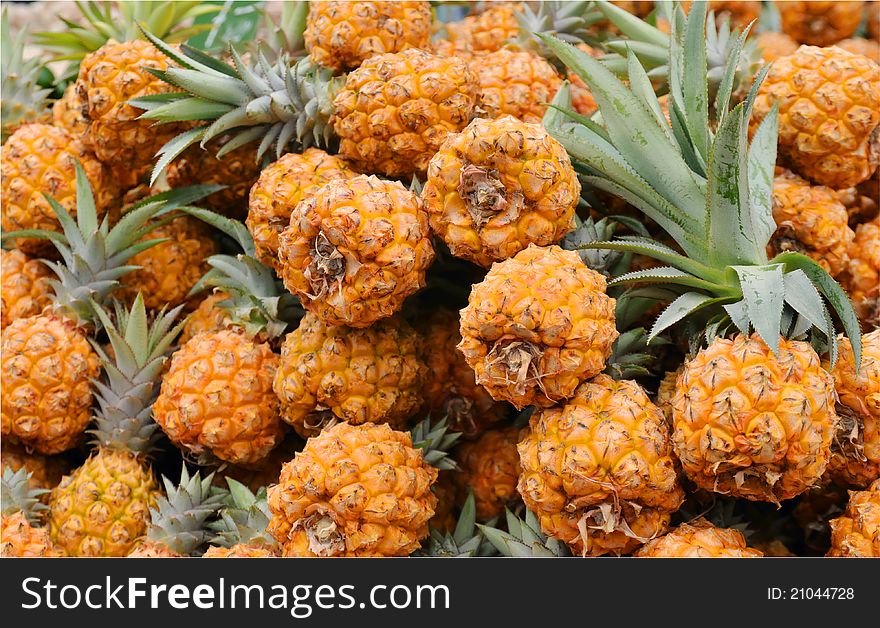 Close up of pineapples on market stand