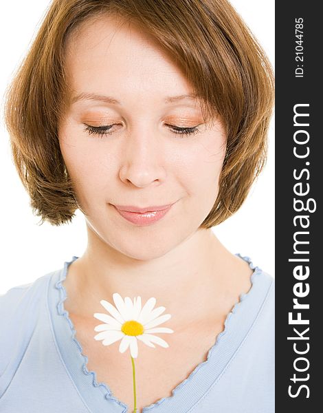 Girl smelling a flower on a white background. Girl smelling a flower on a white background.