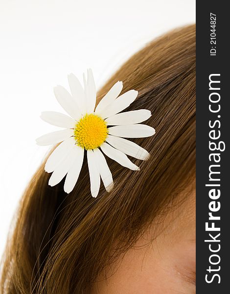 Girl with flower in her hair on a white background. Girl with flower in her hair on a white background.