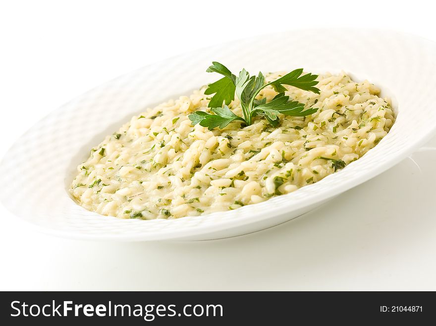 Photo of delicious risotto dish with herbs on white background. Photo of delicious risotto dish with herbs on white background