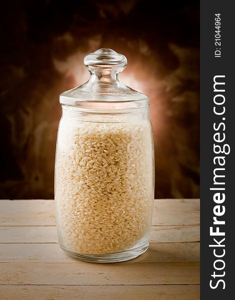 Photo of rice beans inside a glass bowl on wooden table