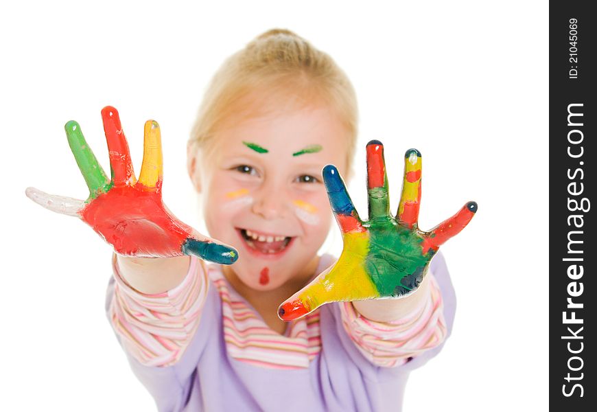 Cute girl playing with colors on a white background.