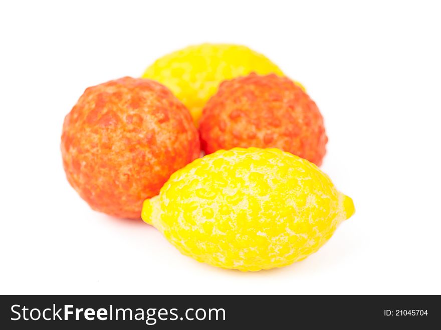 Chewing gum in the form of fruit on a white background