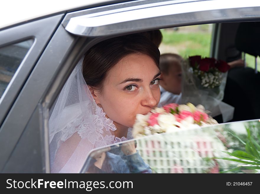 Beautiful Bride Looking Out From Car Window