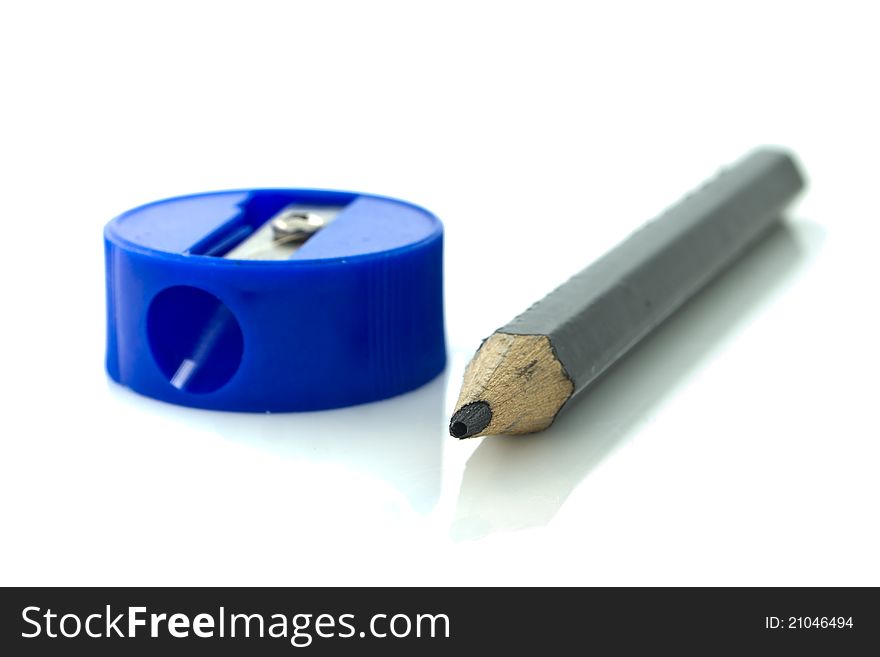 Black pencil and blue sharpener. Black pencil and blue sharpener