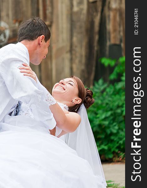 Bride and groom dancing outdoor