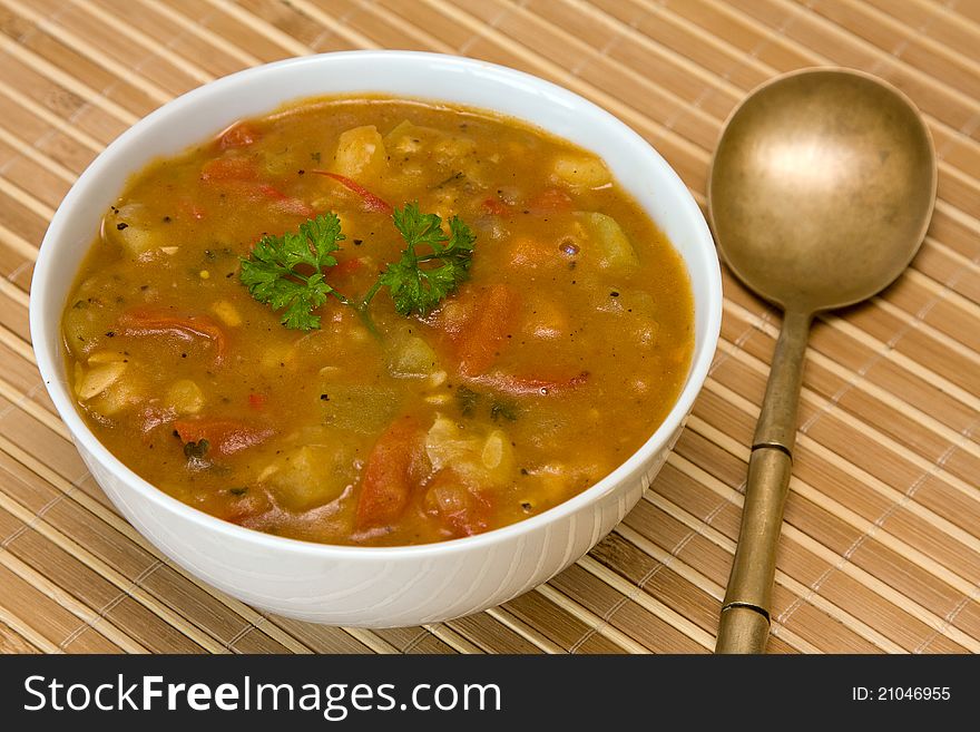 Vegetable soup on white plate