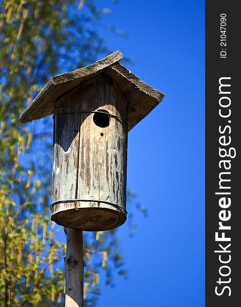 Wooden nest house, with blue sky background