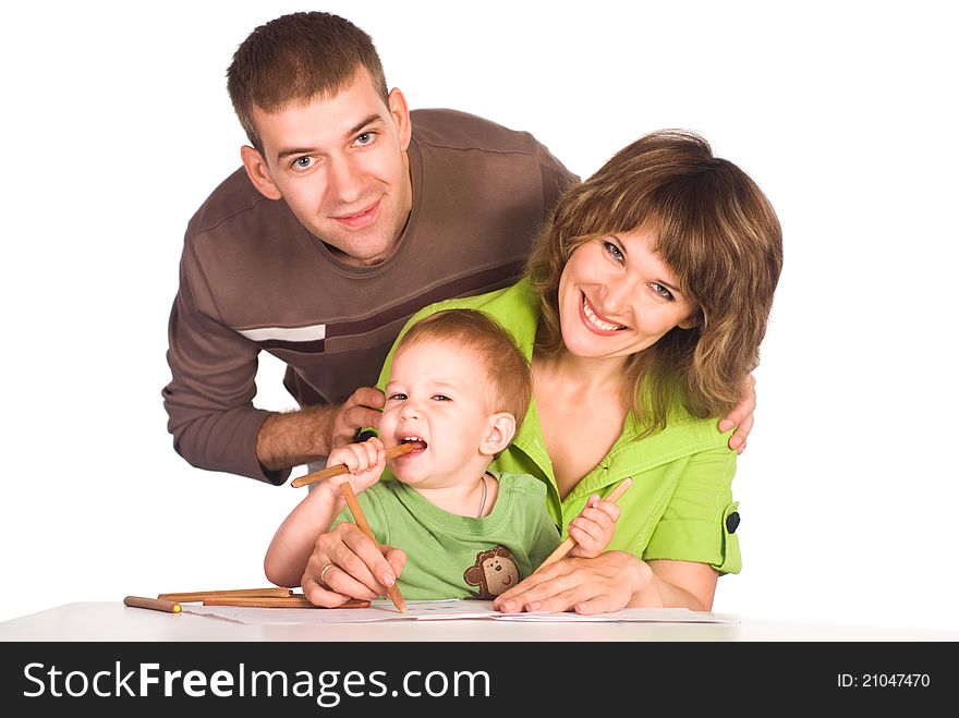 Portrait of a cute family drawing at table. Portrait of a cute family drawing at table