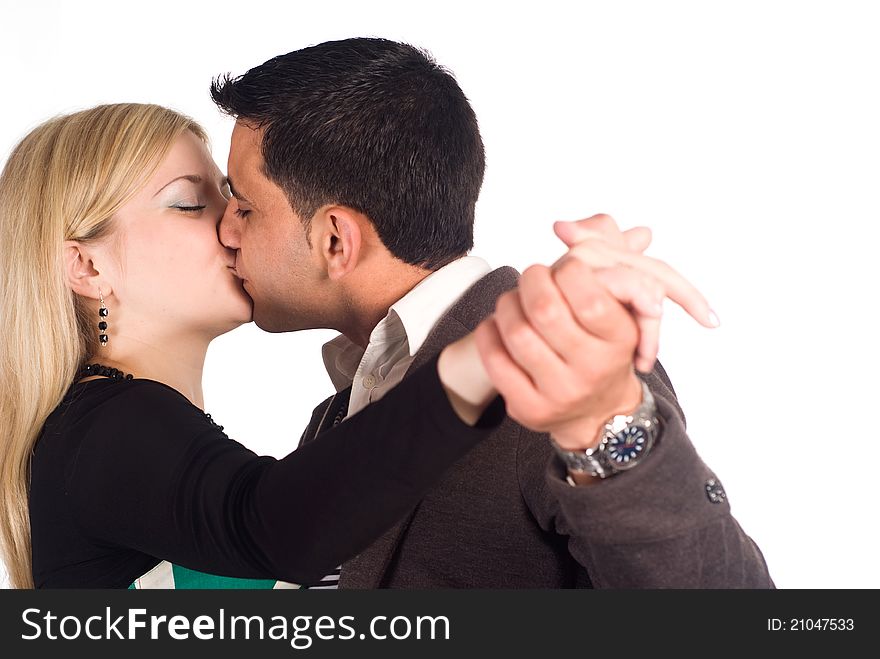 Portrait of a cute couple dancing on a white